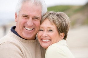 image of older couple smiling and hugging